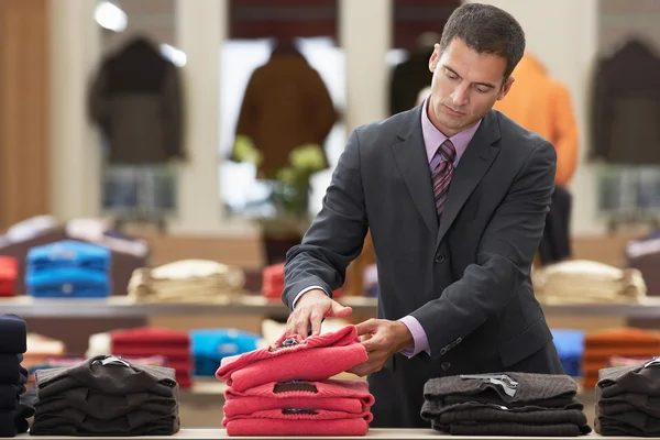 Businessman shopping in clothes store — Stock Photo, Image