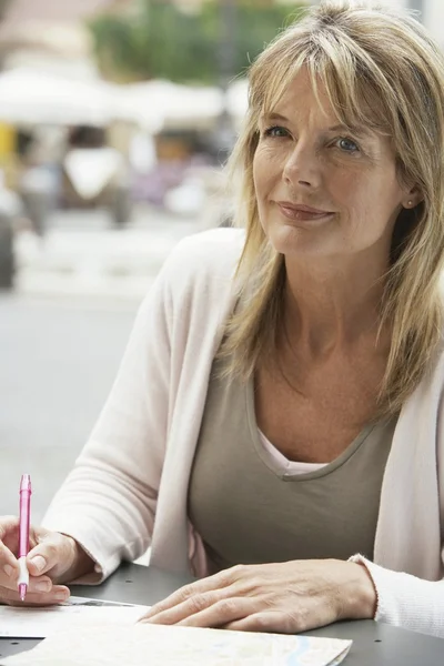 Woman tourist signing Postcard — Stock Photo, Image