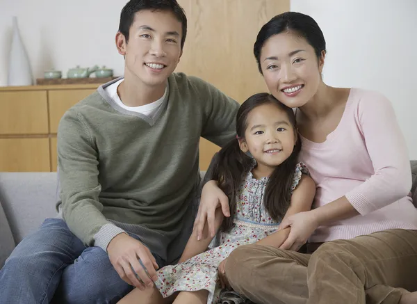 Couple and daughter Posing on Sofa — Stock Photo, Image