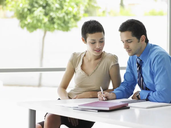 12300040Businessman and woman at office table Royalty Free Stock Photos