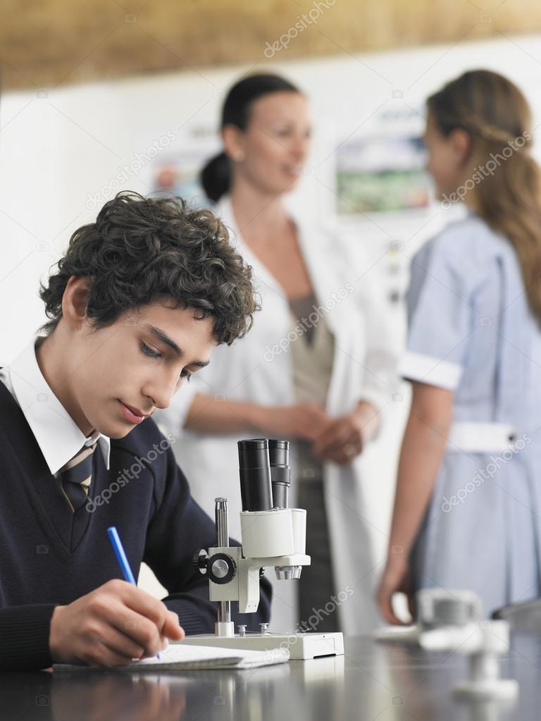 High school students with microscopes 