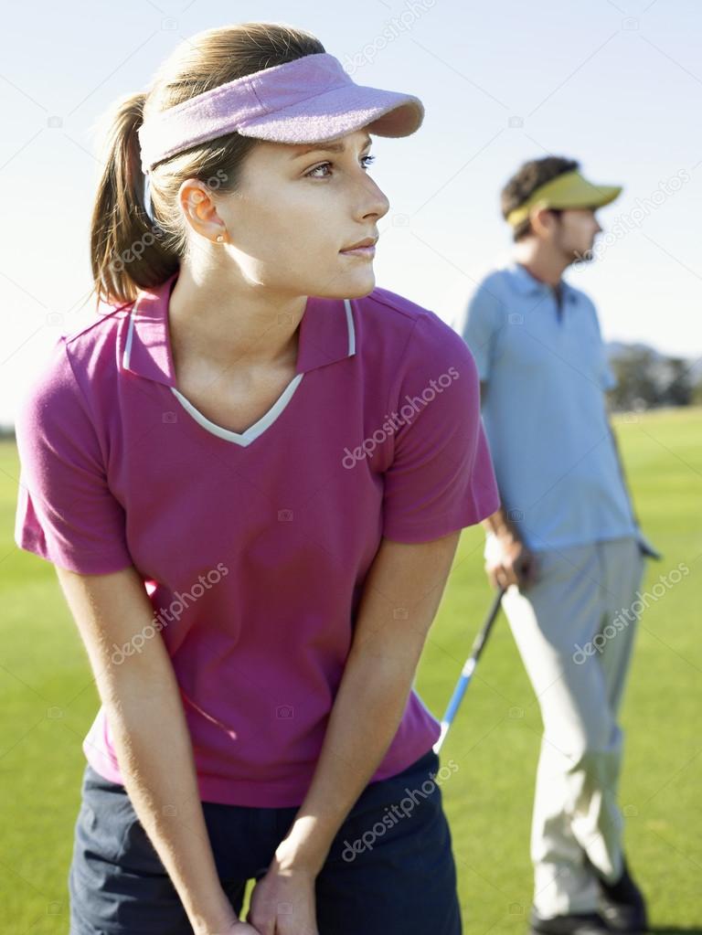 Young woman playing golf