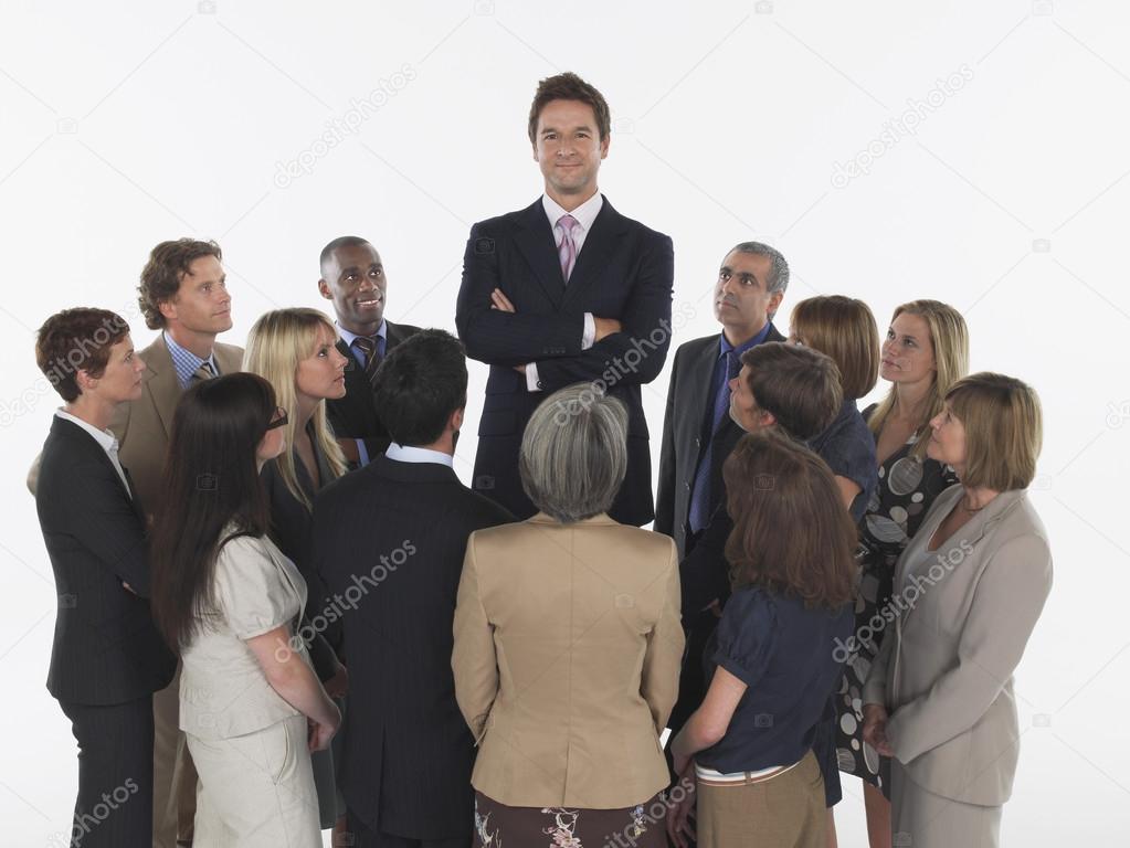 Businesspeople Staring at Tall Man