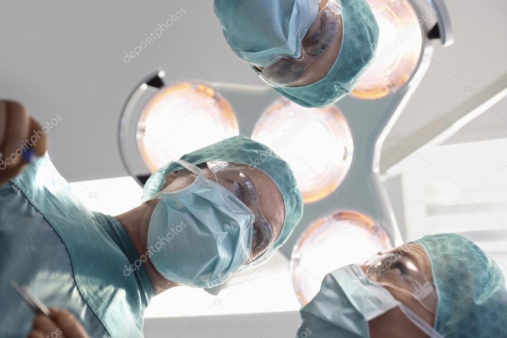 Doctors in surgery discussing procedure