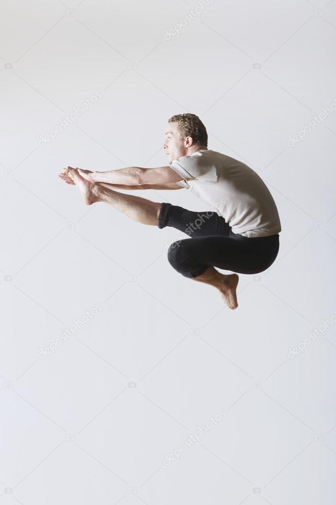Ballet dancer leaping in mid-air