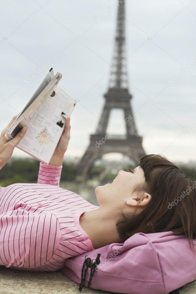 Tourist Looking at Guidebook