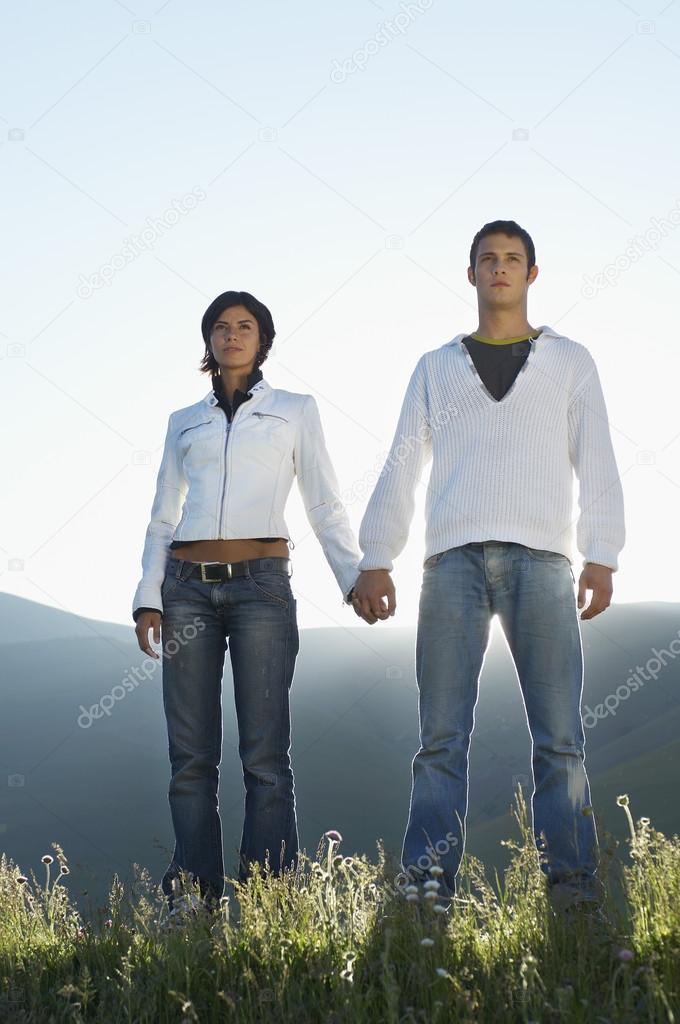Couple in mountain field