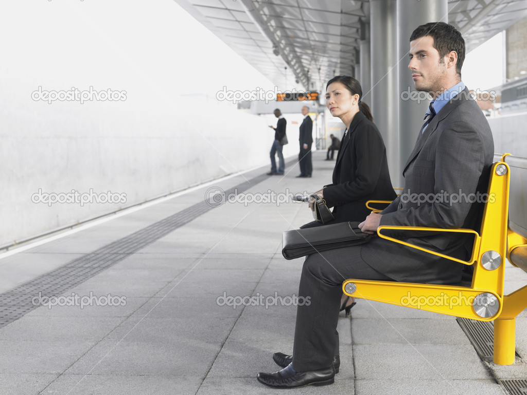 Businesspeople Waiting for train