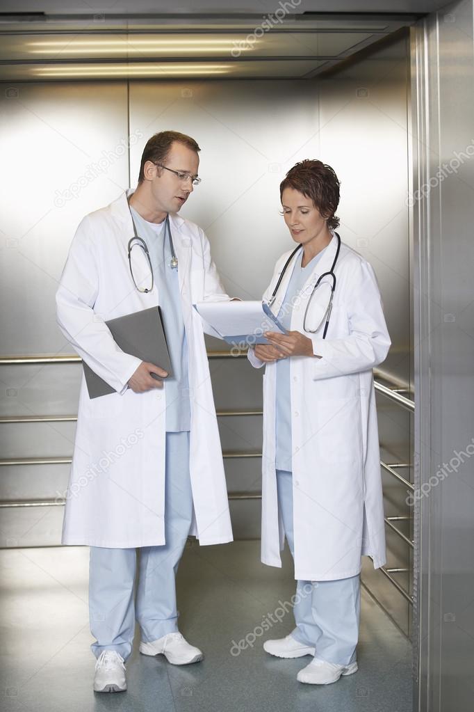 Physicians Discussing Chart