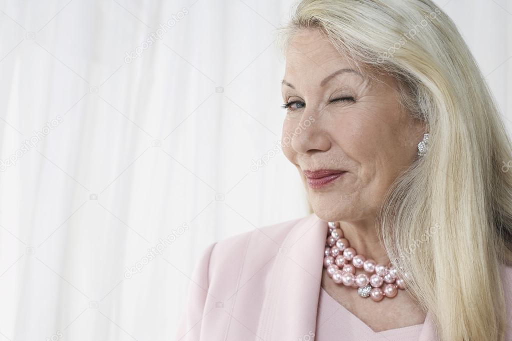 Senior woman winking
