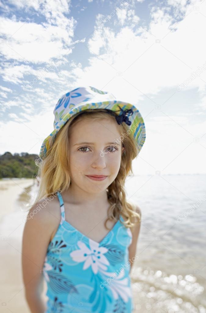 Girl standing on beach 