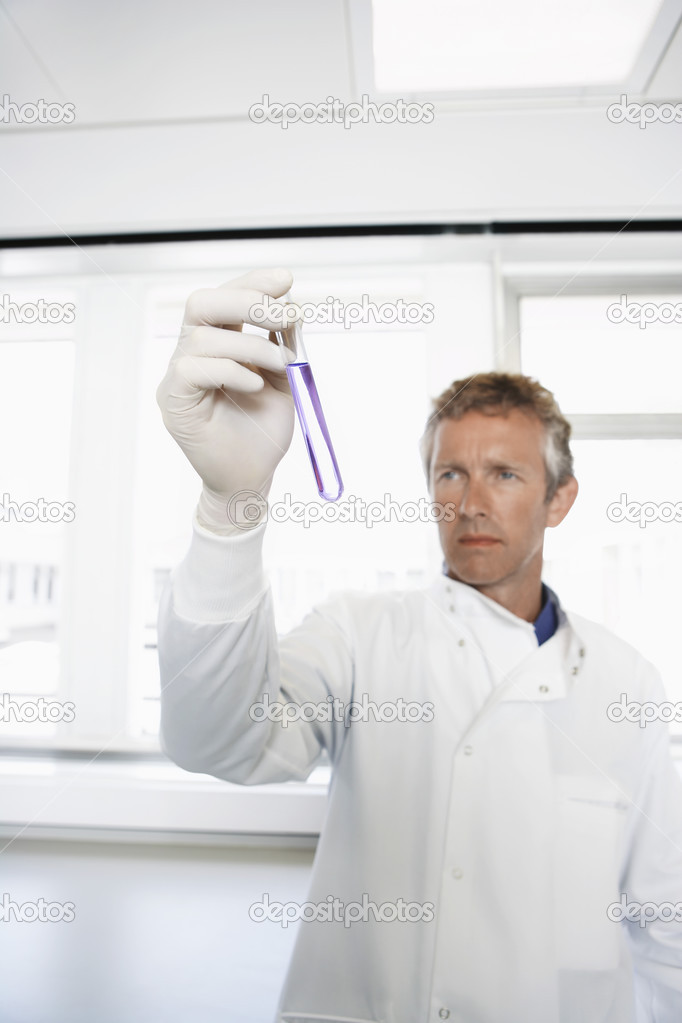Lab Worker Examining Test Tube
