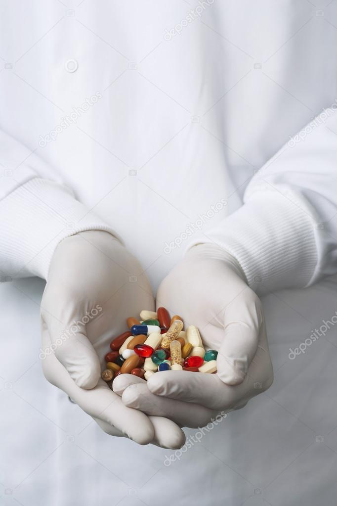 Lab Worker with Hands of Pills