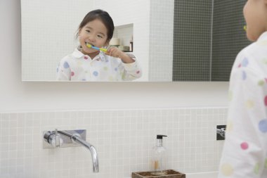 Japanese Girl Brushing Teeth clipart