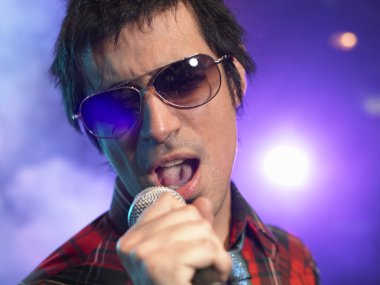 Rock Singer Performing on Stage clipart