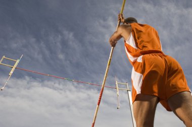 Pole vaulter preparing for a jump clipart