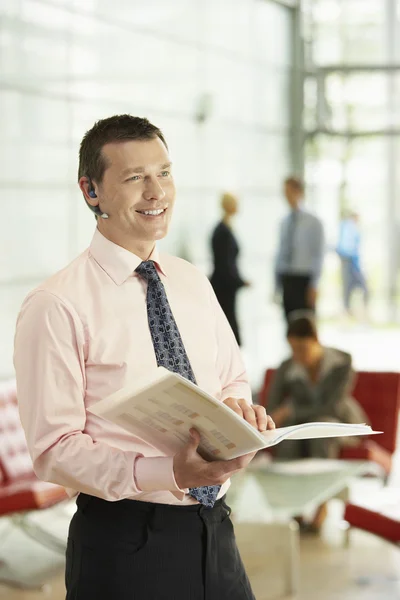 Businessman Holding Report — Stock Photo, Image