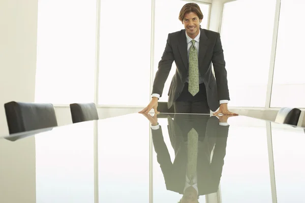 Businessman at conference table — Stock Photo, Image