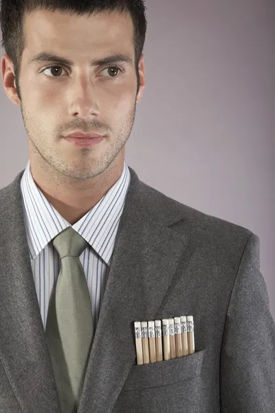 Молодой бизнесмен с карандашами — стоковое фото