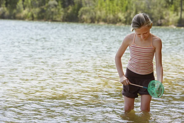 Girl Playing with fishing net — Stock Photo, Image