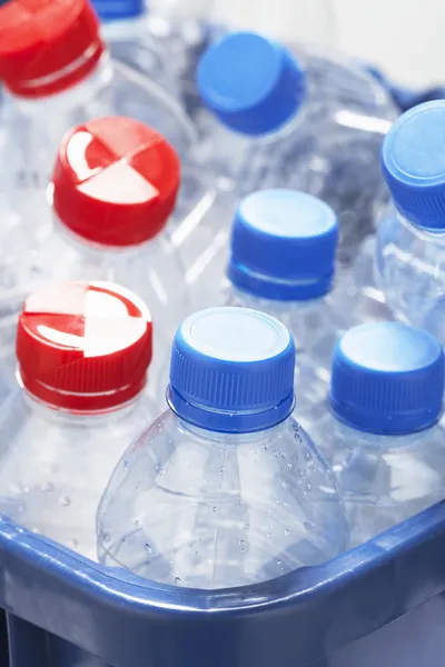 Empty plastic bottles in container — Stock Photo, Image