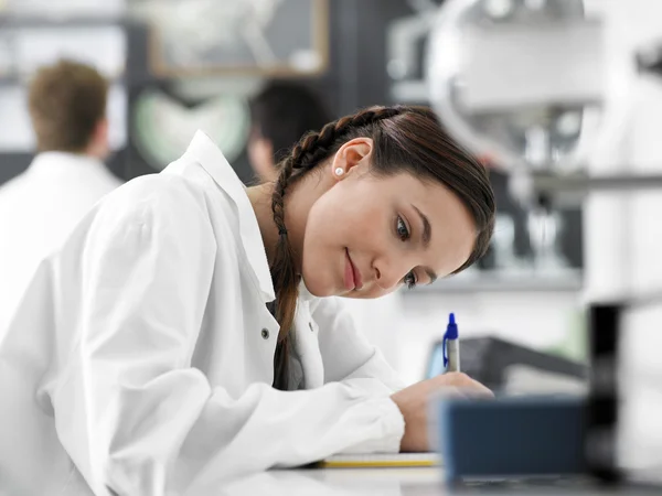 High School female  Student  with microscope — Stock Photo, Image