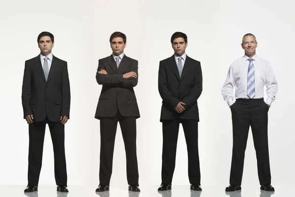 Businessmen standing side by side — Stock Photo, Image