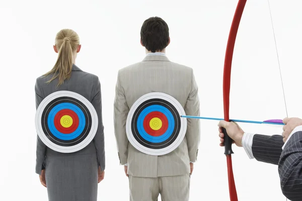 Two business people with targets on backs — Stock Photo, Image