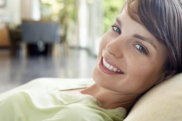 Woman Relaxing on Sofa — Stock Photo, Image