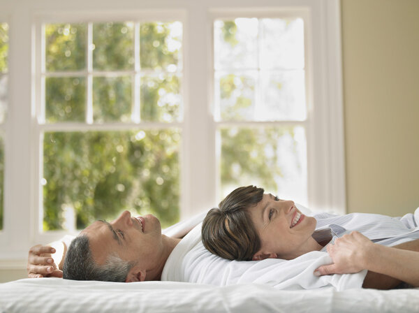 Couple relaxing in bed