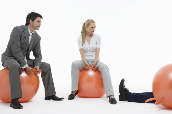 People sitting on space hoppers — Stock Photo, Image