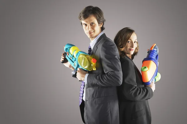 Businesspeople Holding Water Guns — Stock Photo, Image