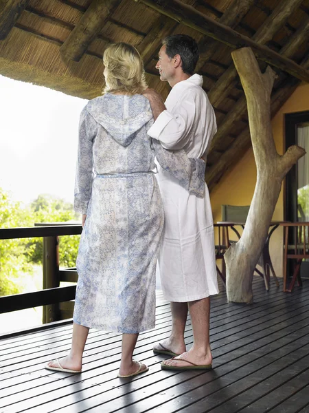 Couple in bathrobes embracing — Stock Photo, Image