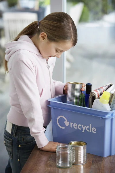 Girl  putting empty vessels — Stock Photo, Image