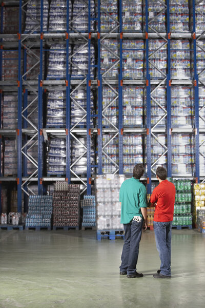 Men at Full Warehouse Shelves