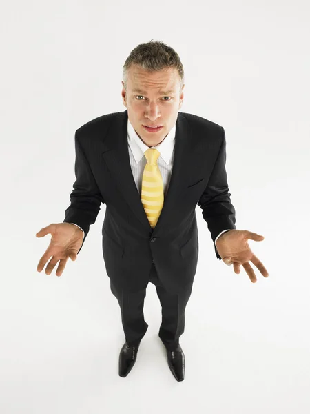 Man in suit with palms raised — Stock Photo, Image