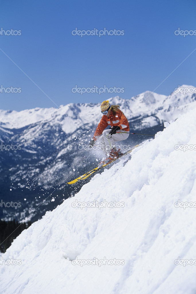 Skier skiing down