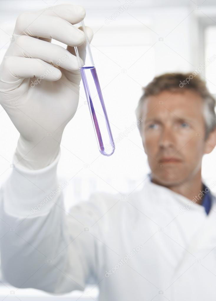 Lab worker holding petri dish
