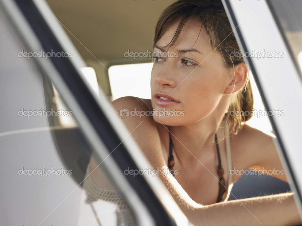 Woman sitting in van 