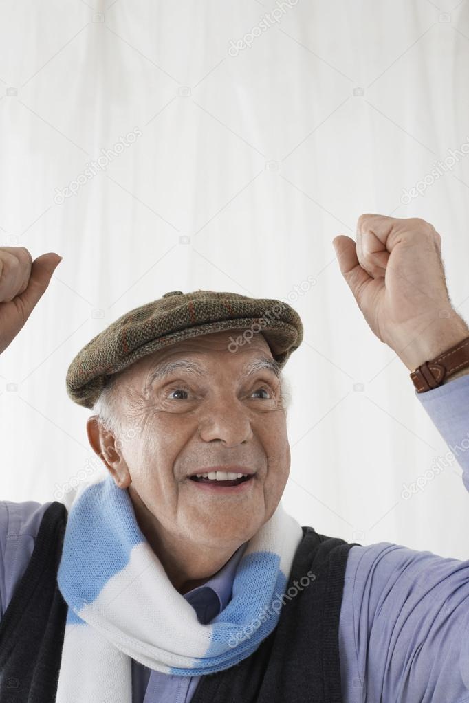 man in  scarf celebrating