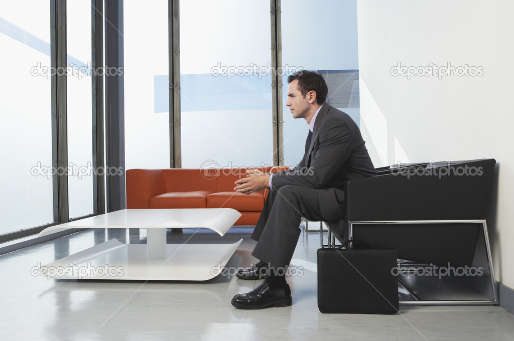 Businessman sitting in waiting room