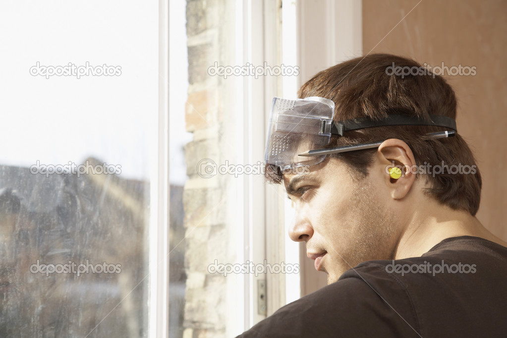 Man wearing goggles and earplugs