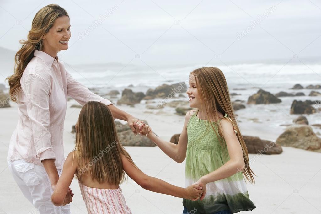 Mother playing with two daughters