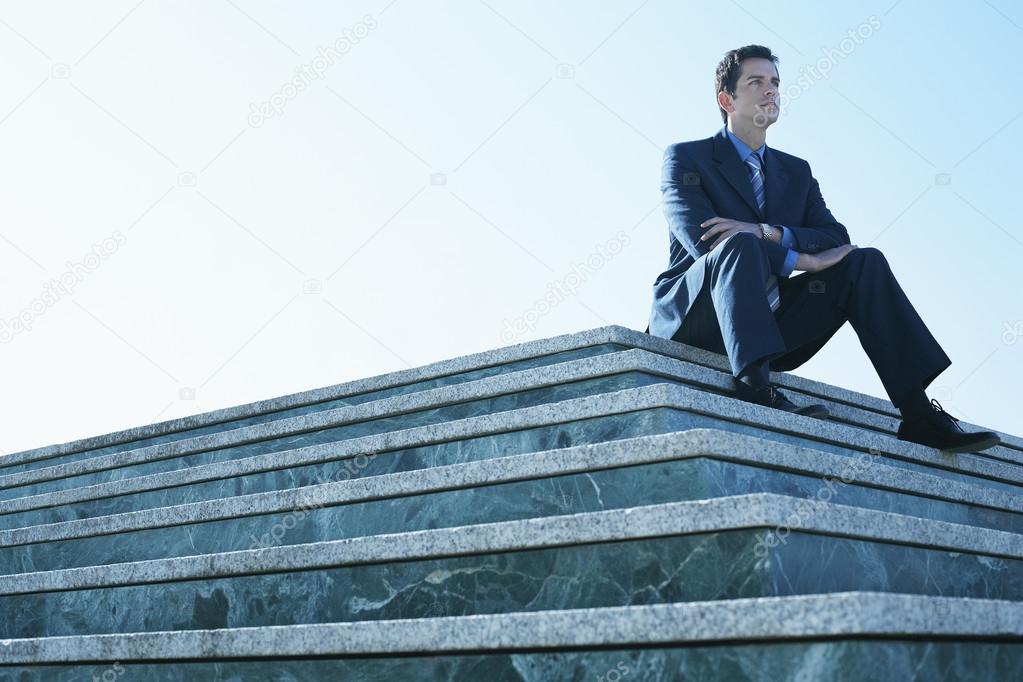 Man sitting on marble platform