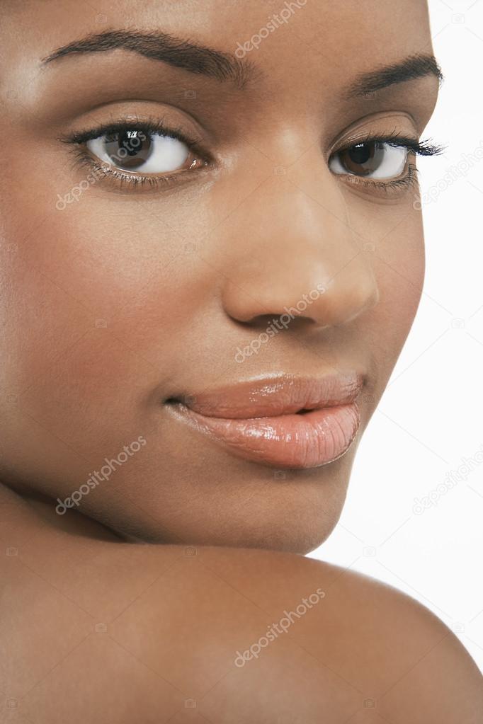 Young woman looking over shoulder