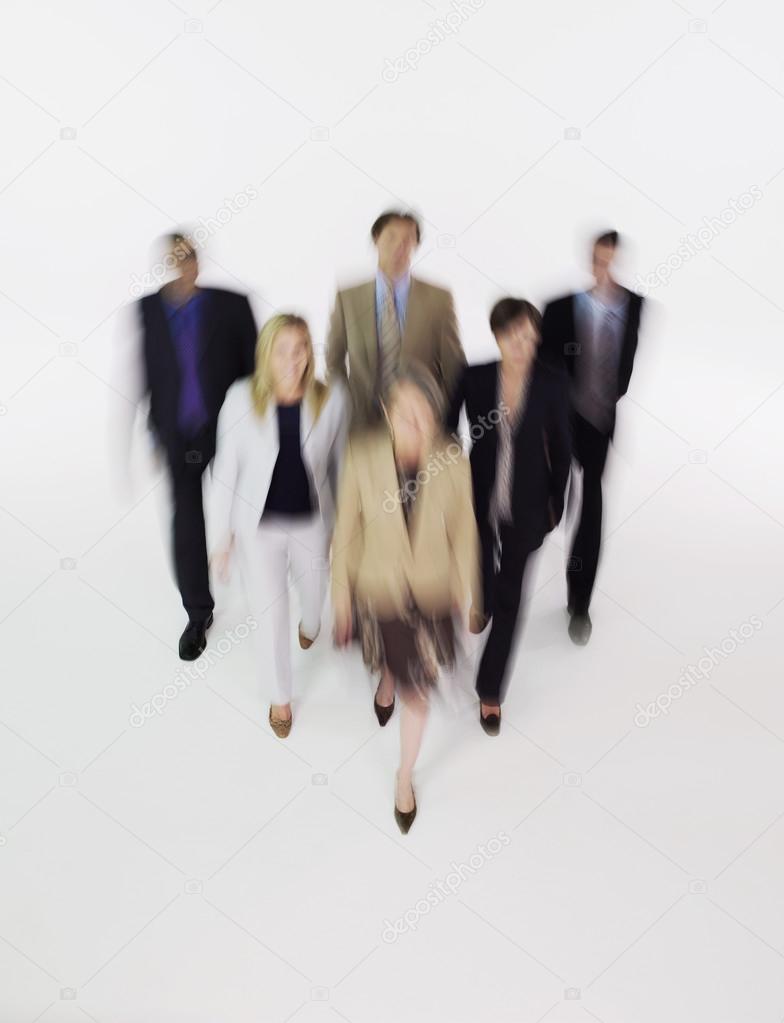 Businesspeople walking blurred effect