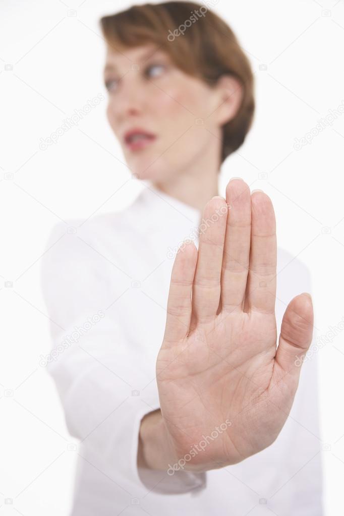 Woman holding up hand