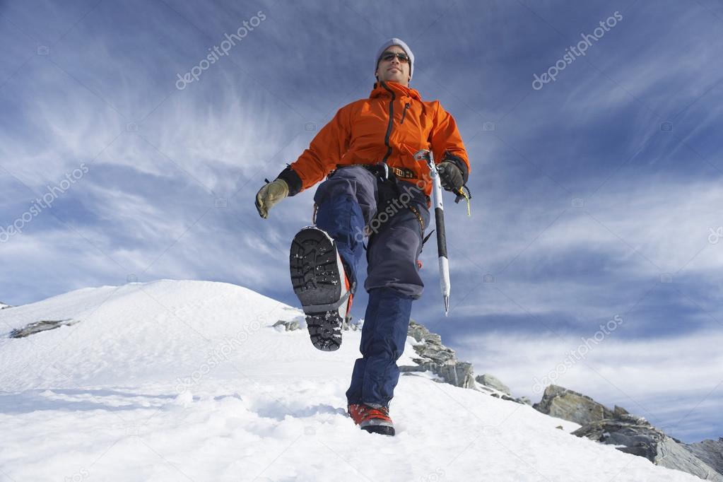 Mountain climber on snowy slope