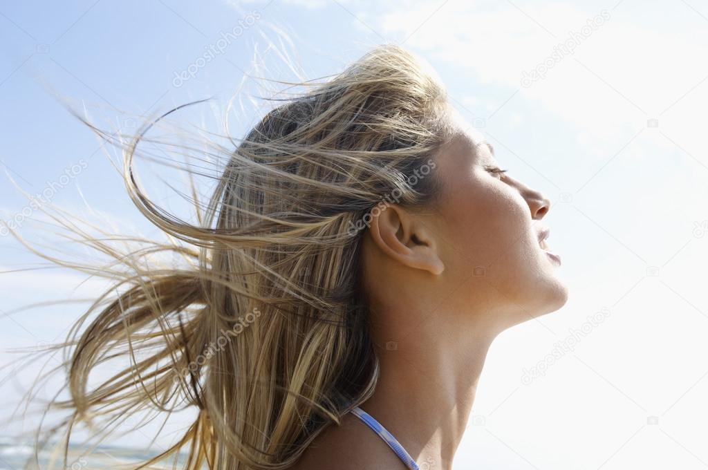 Woman with wind-swept hair