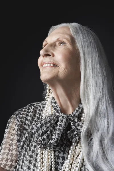 Senior Woman looking up — Stock Photo, Image